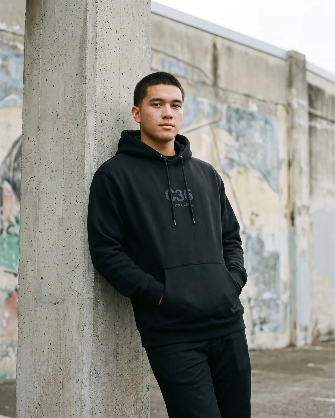 C36-003 black hoodie front worn in Kakaʻako: tonal C36 monogram